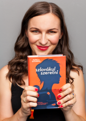 Durica Katarina holding the book „Loving in Slovakian”